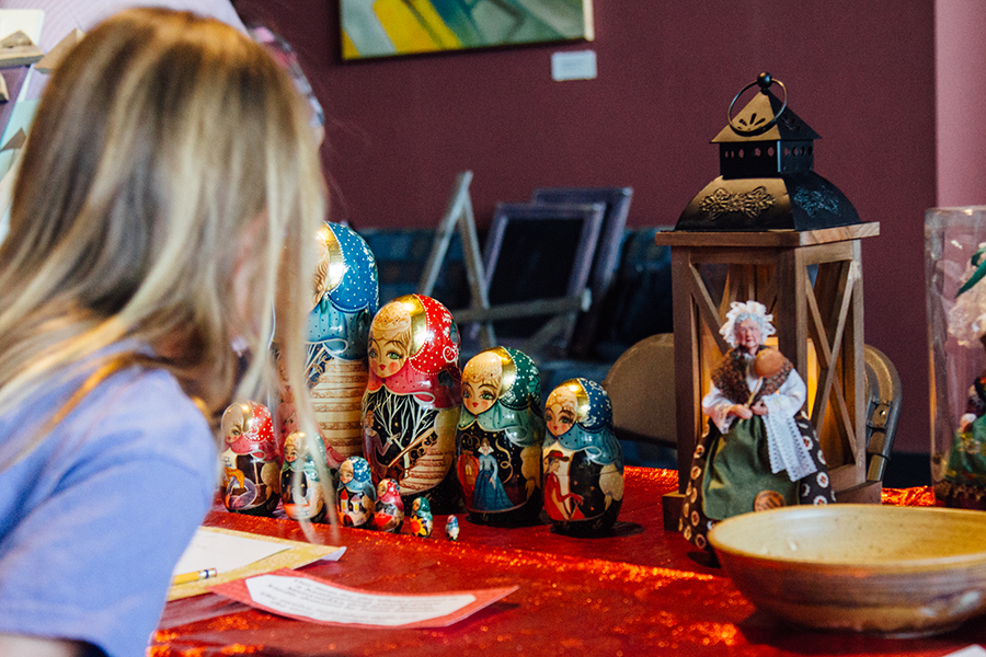 A person looking at some items at a Christmas market hosted by the UNCA German club