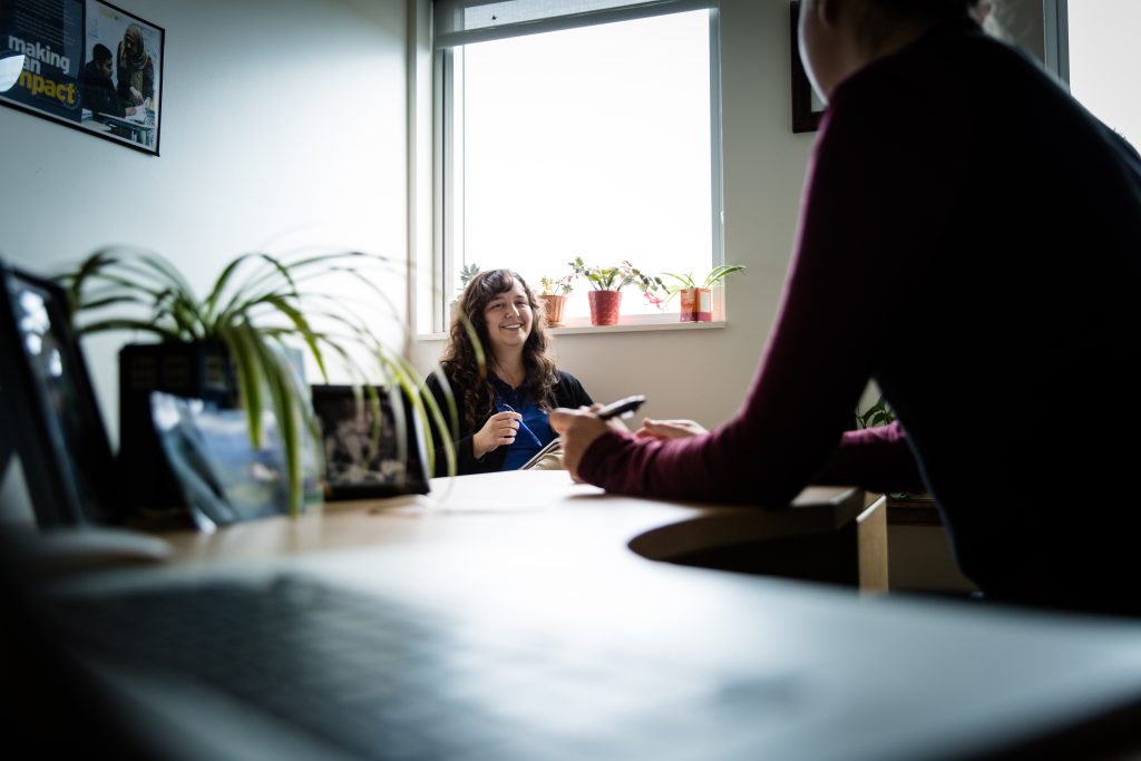 someone sitting down for an interview on an office