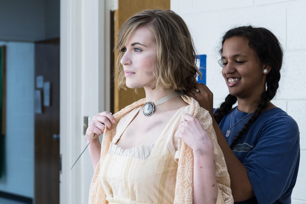 Emily Crock as Corday, with another Drama student working on the costume