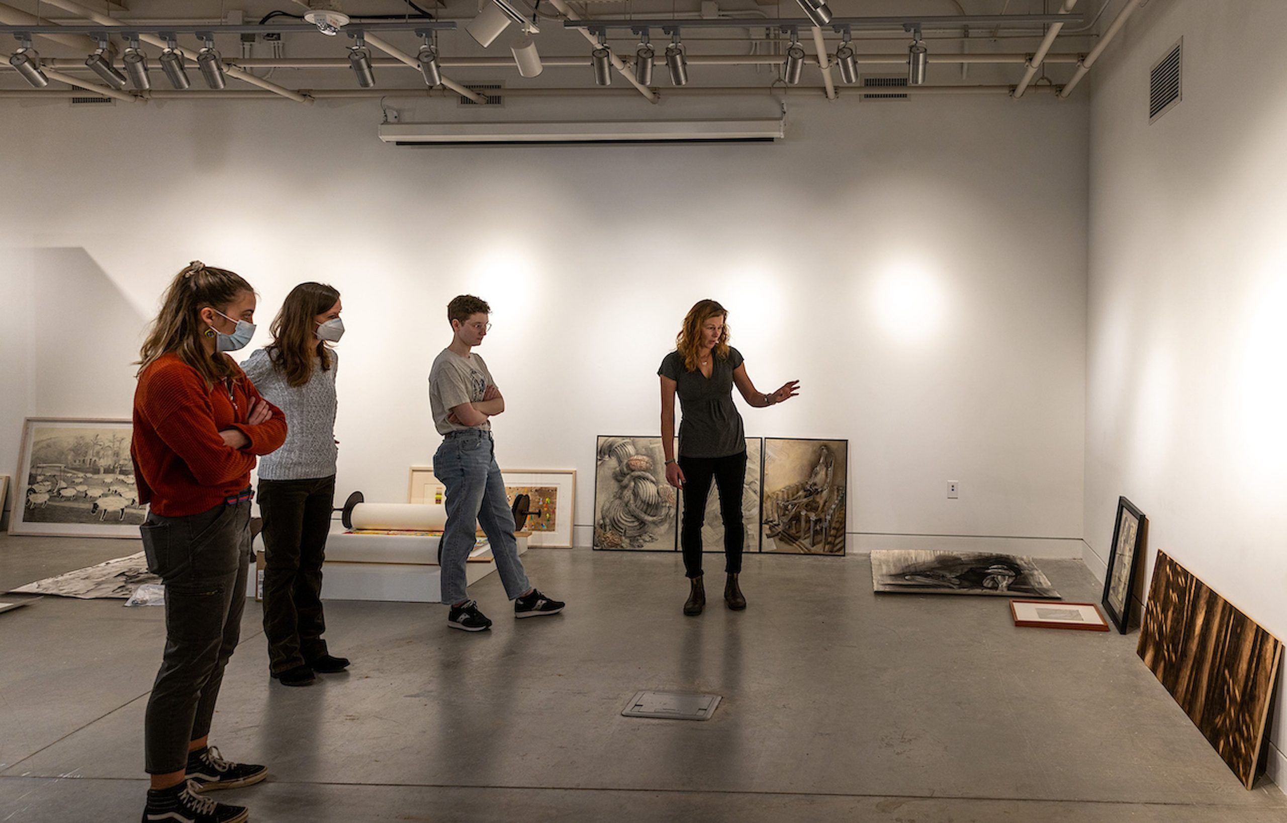 art students examining art in a gallery
