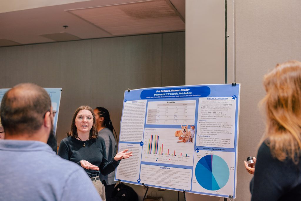 A student presenting a research project at a symposium