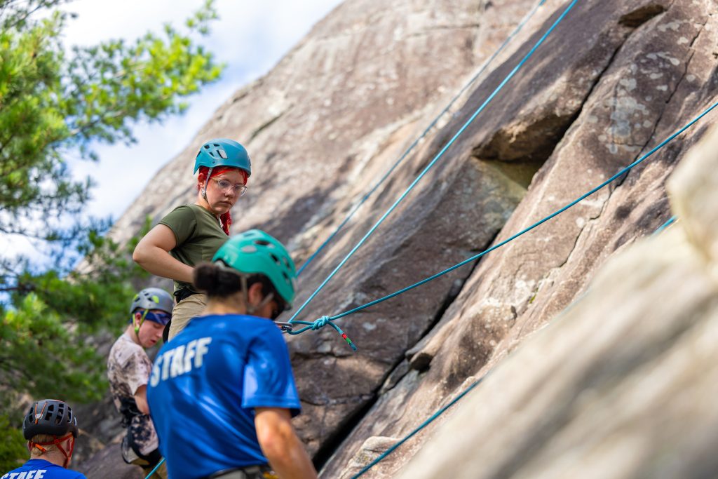 people rock climbing during embark orientation