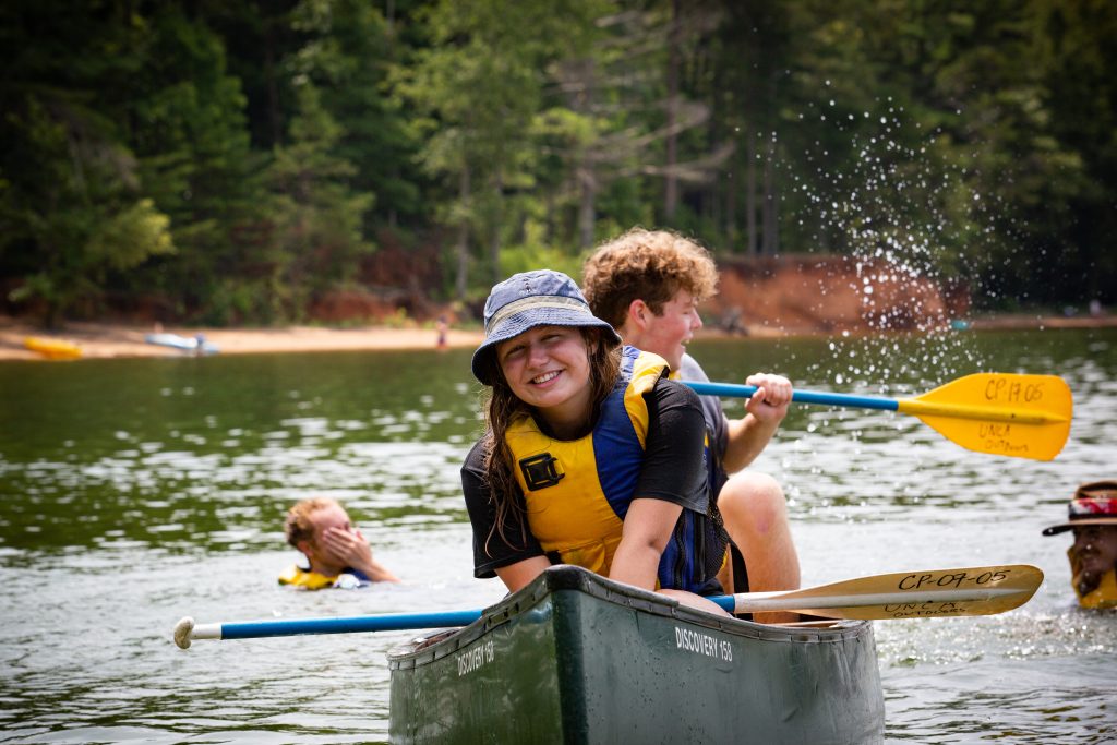 two incoming students canoeing together
