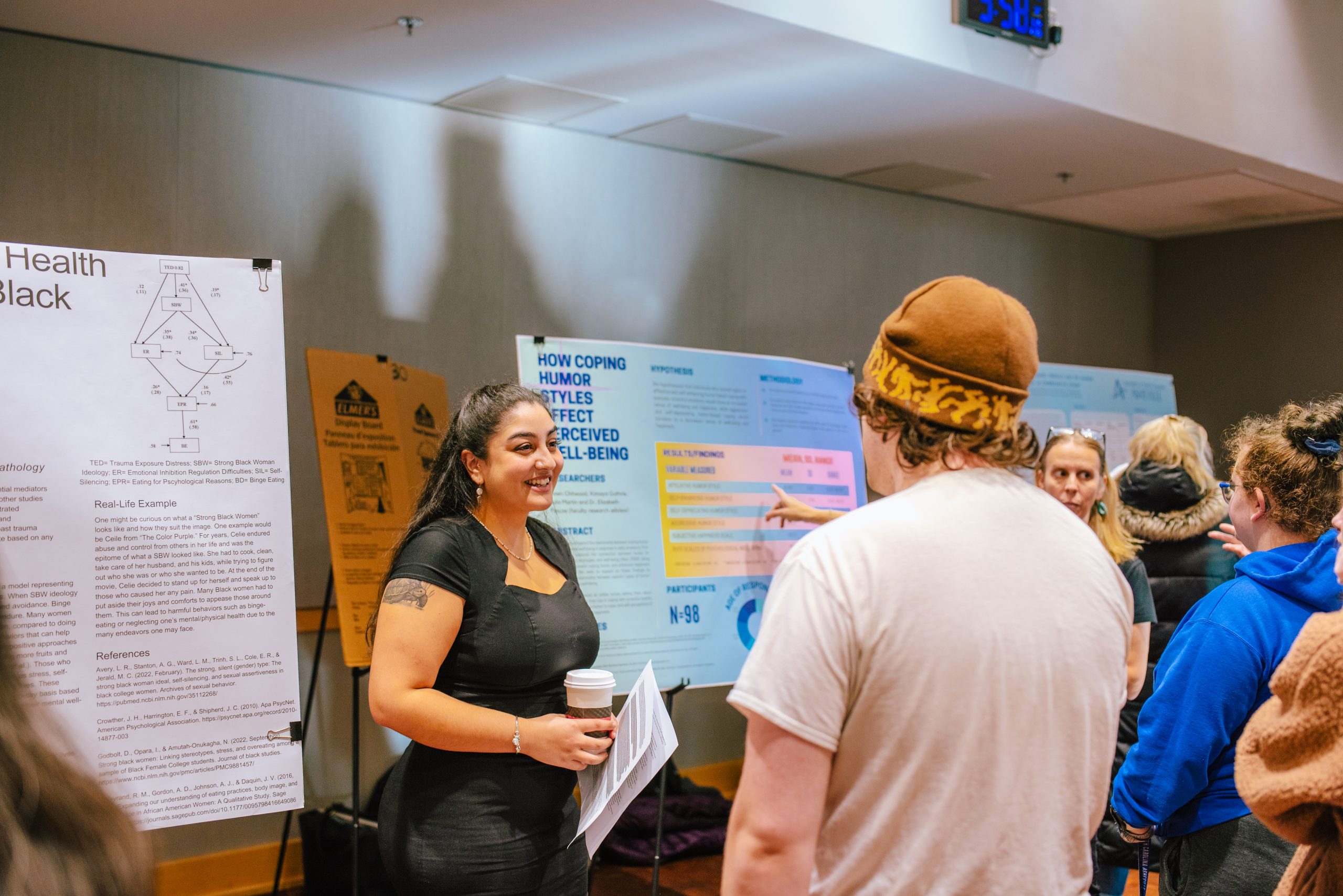 A student showing an undergraduate research project at a symposium