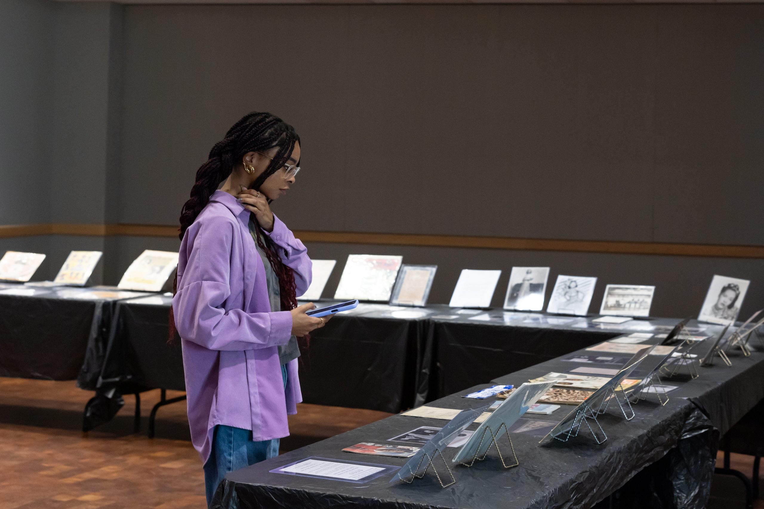 a student looking at the Black History Month Mobile Museum Exhibit 