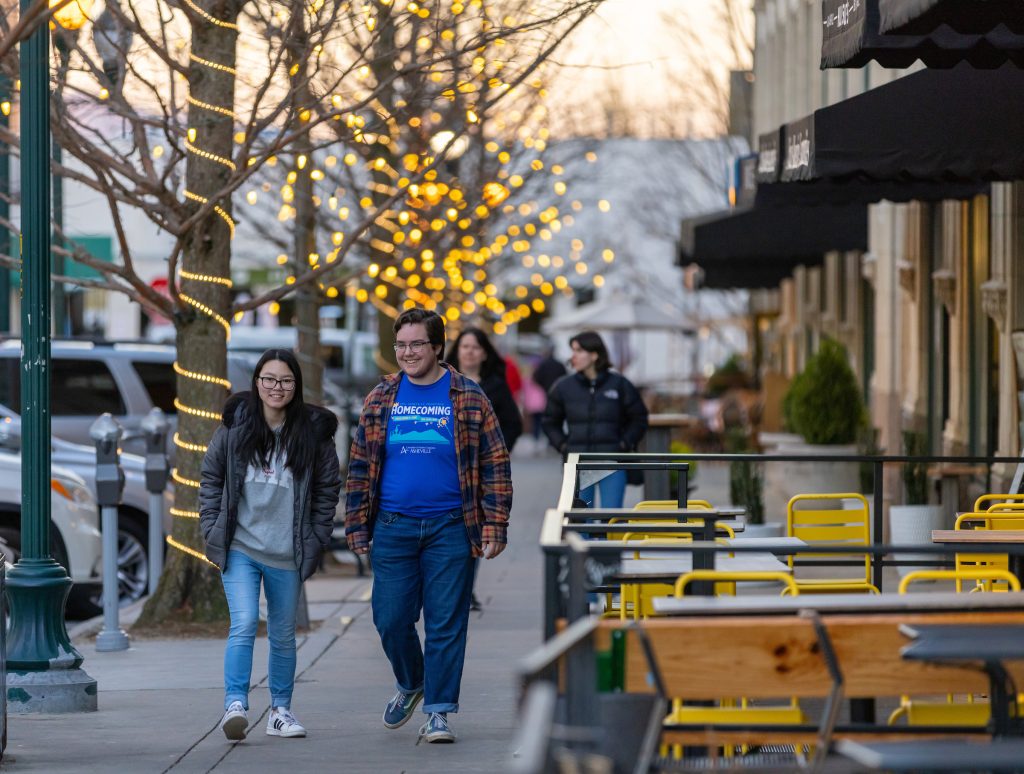 Two students walking in downtown asheville
