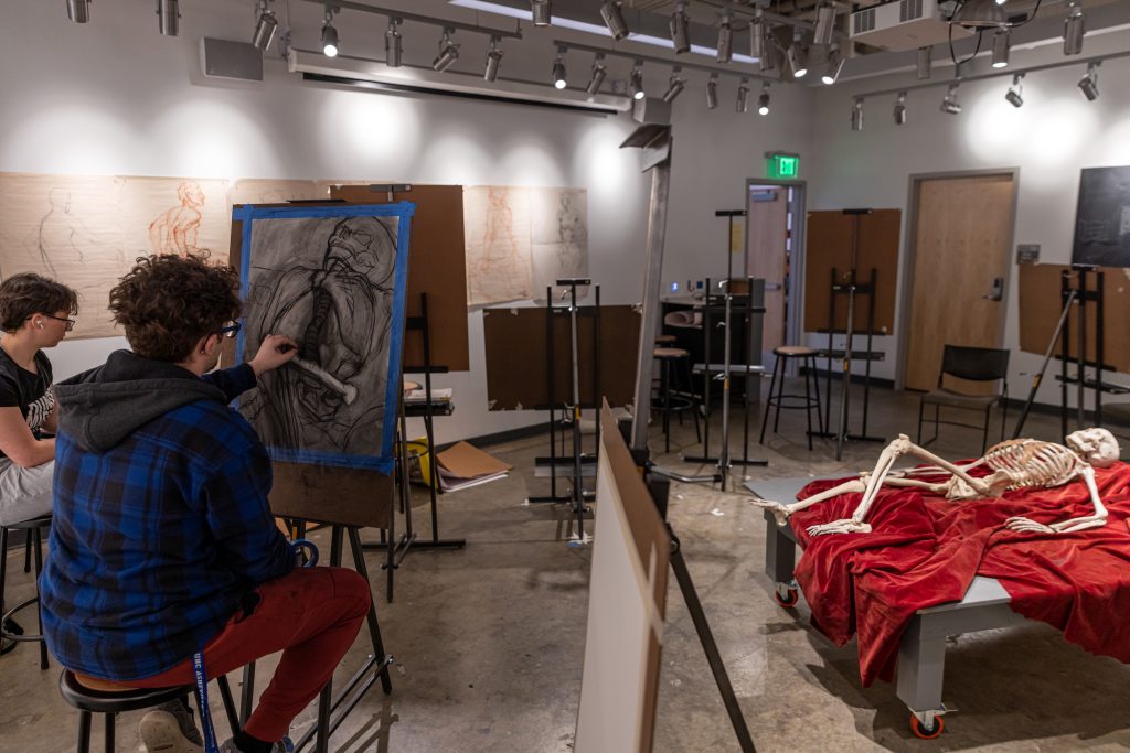 students drawing in an art gallery in owen hall