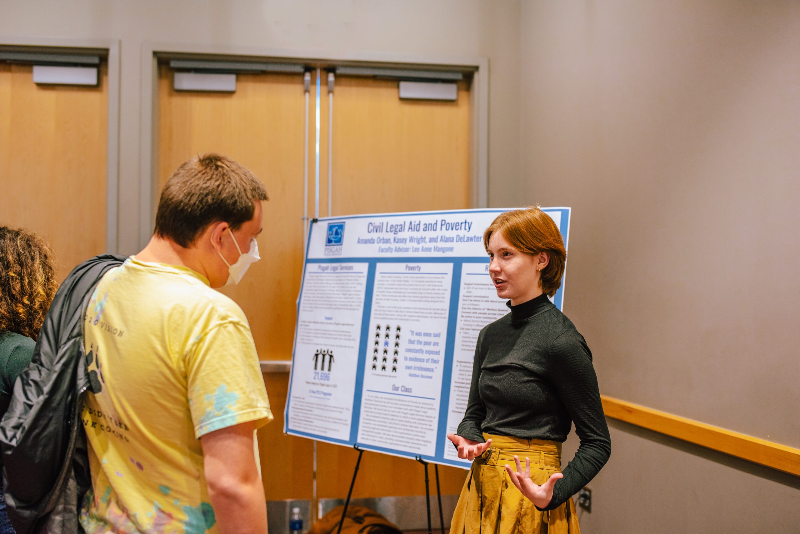 a student presenting their research at an undergraduate research symposium