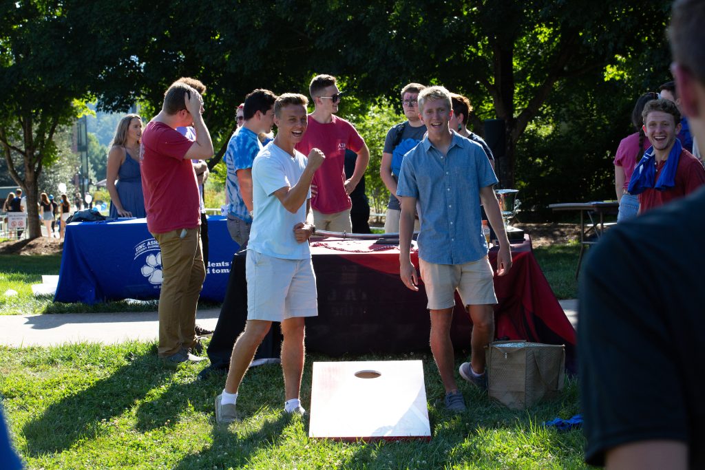 people playing cornhole on the quad