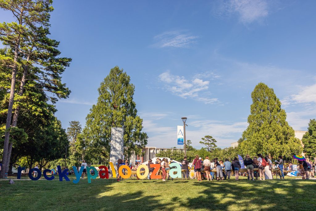 Rockypalooza spelled out in large colorful letters on the quad