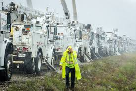 Lineman trucks gathered to restore power to affected areas